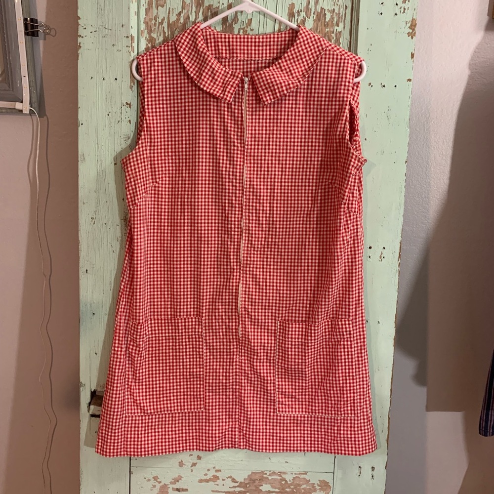 Red and white gingham sleeveless zip up top with pockets